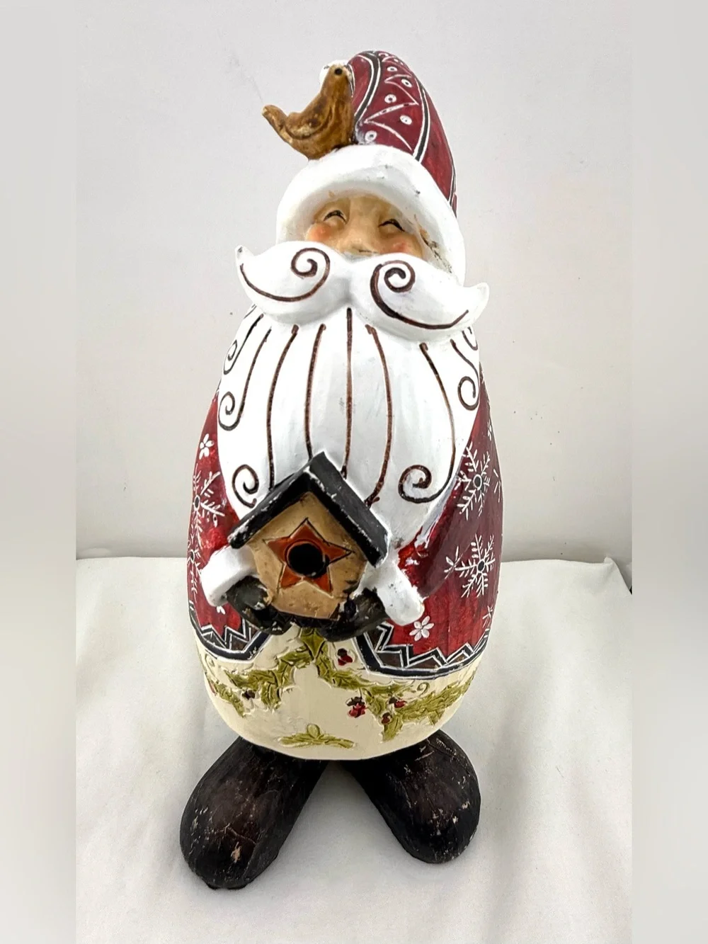 Folk art style resin Santa Claus figurine